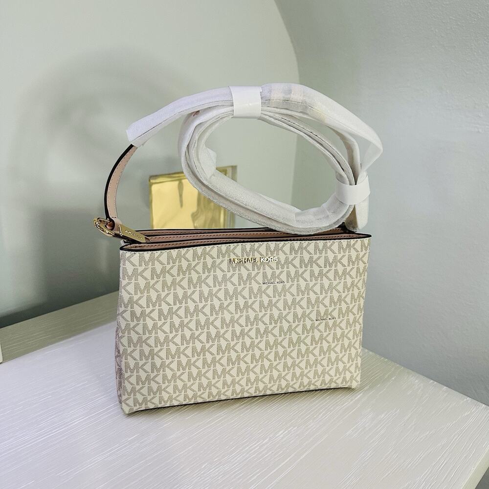 Michael Kors Trisha Medium Logo Crossbody Bag in a vanilla/light cream and pink
